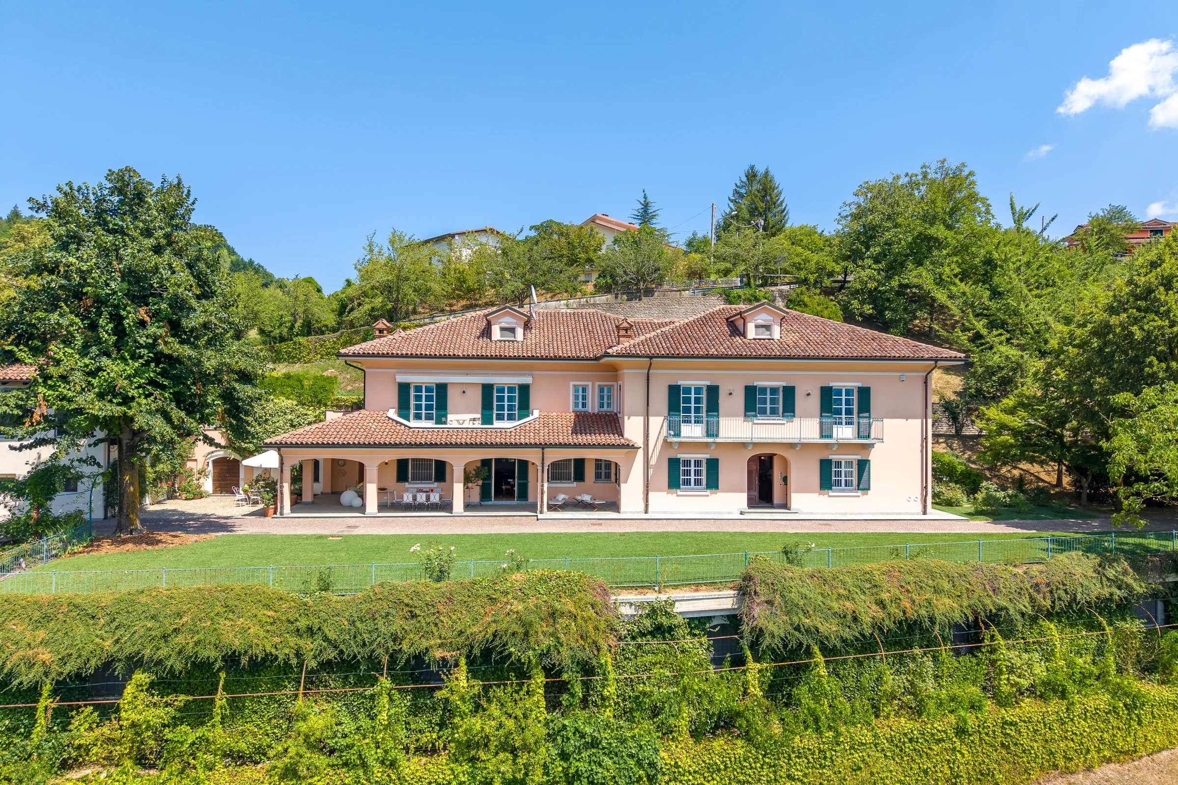 Villa facade seen from a low aerial perspective — Villa Ceva, Italy. Photography by Yunes Calore.