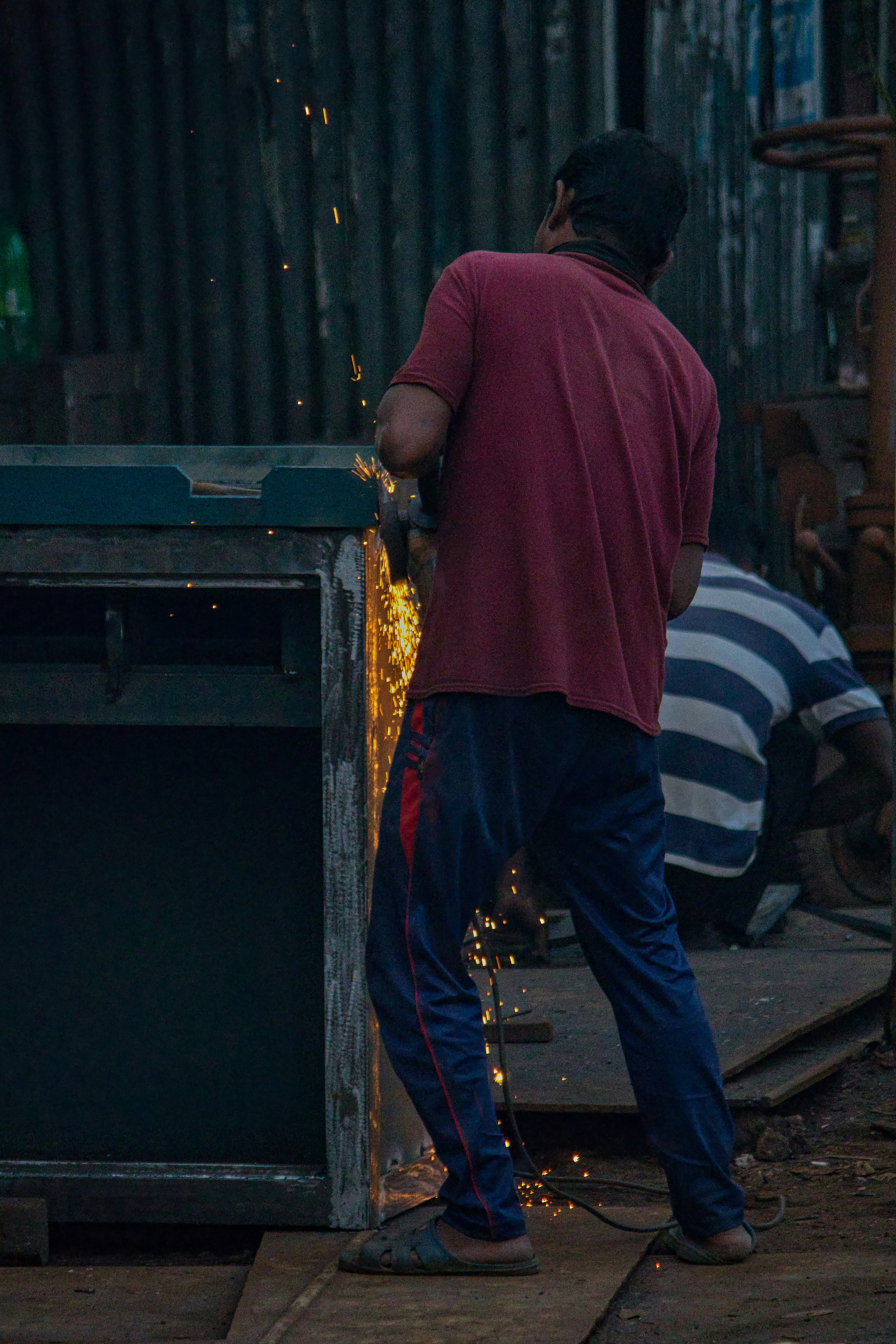 a man working on a piece of metal