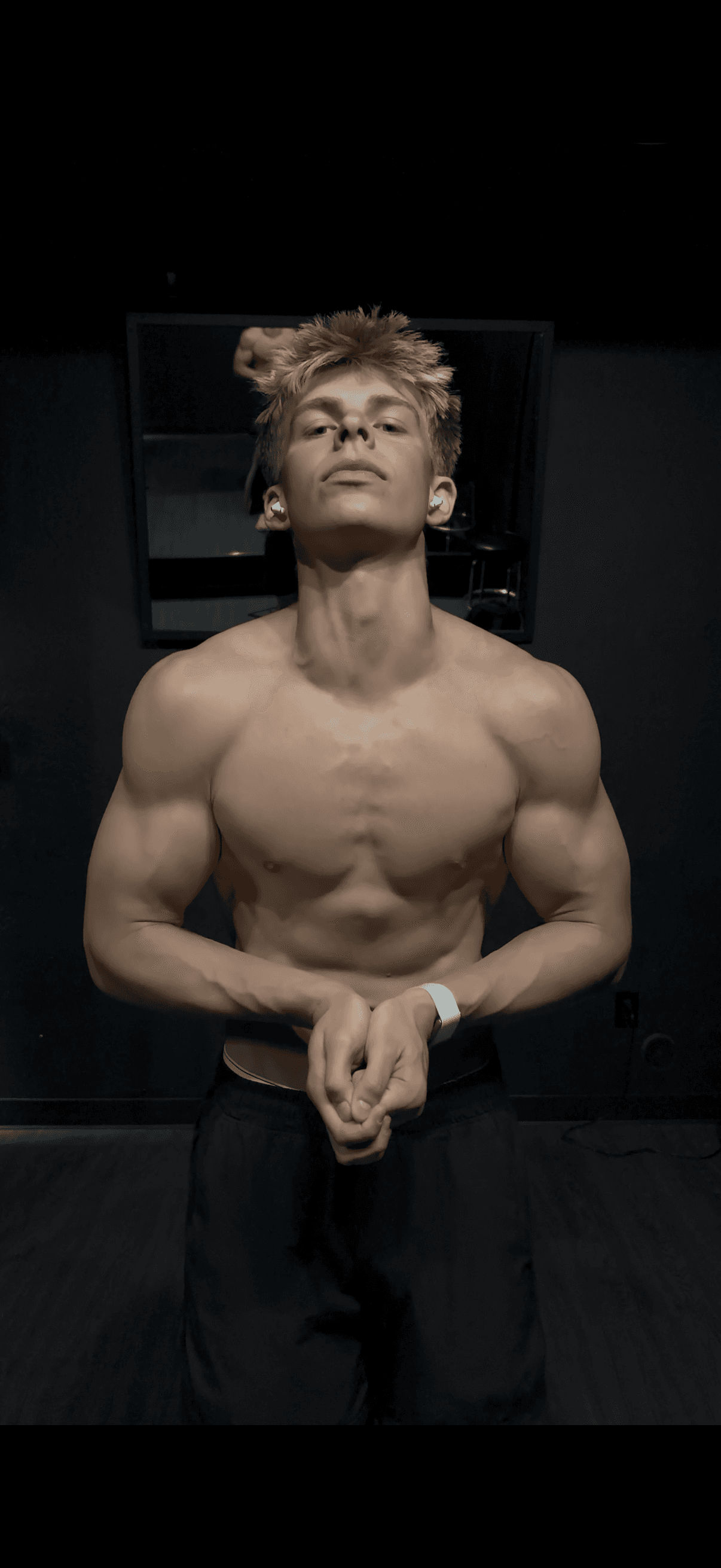 Athlete training with focus in a dark gym