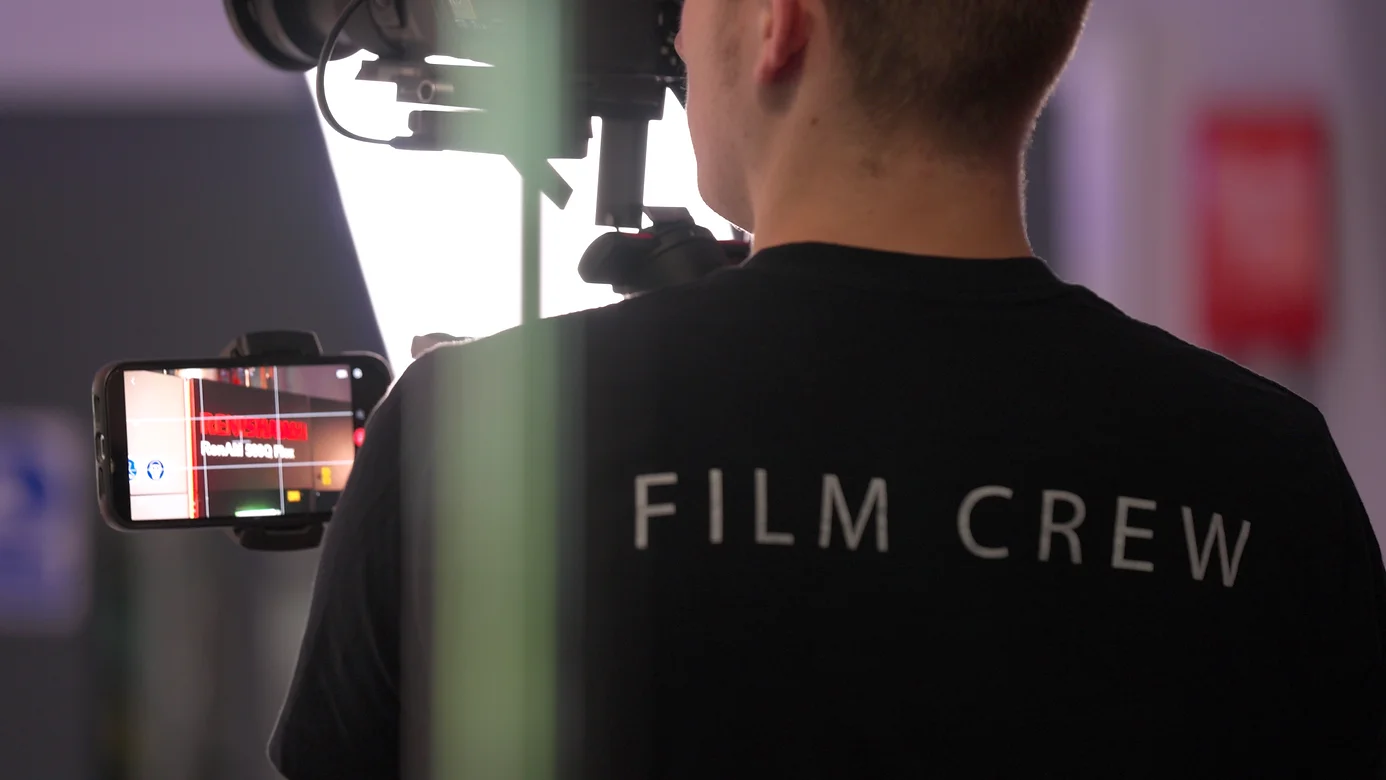Nomadic UK film crew on set at an engineering firm creating a promo video