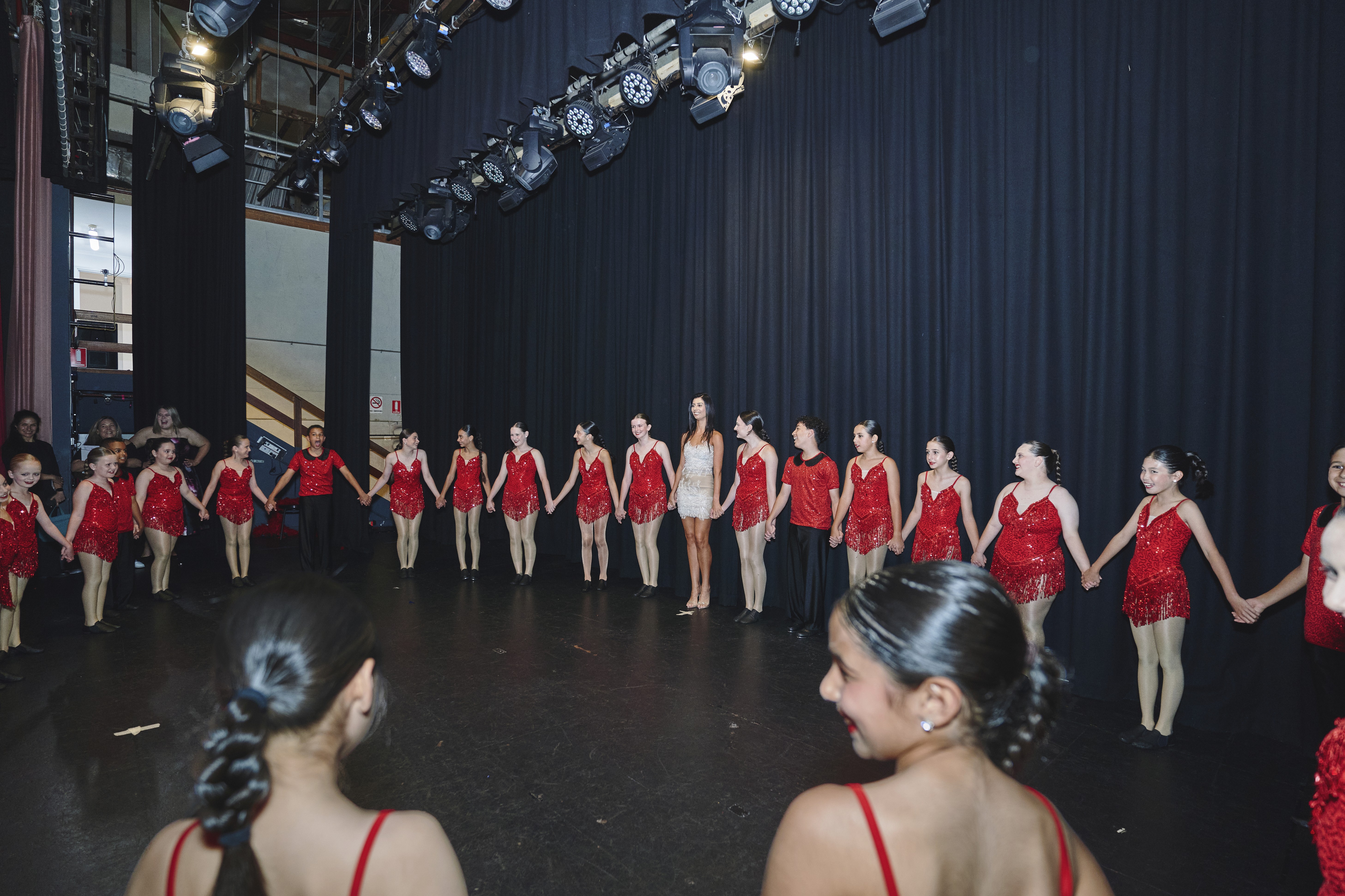 Teachers presenting award on stage