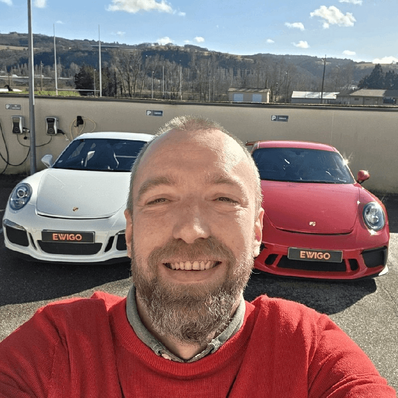 man in gray polo shirt smiling