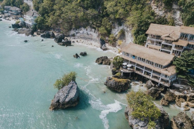 sunloungers fronting buildings near mountain