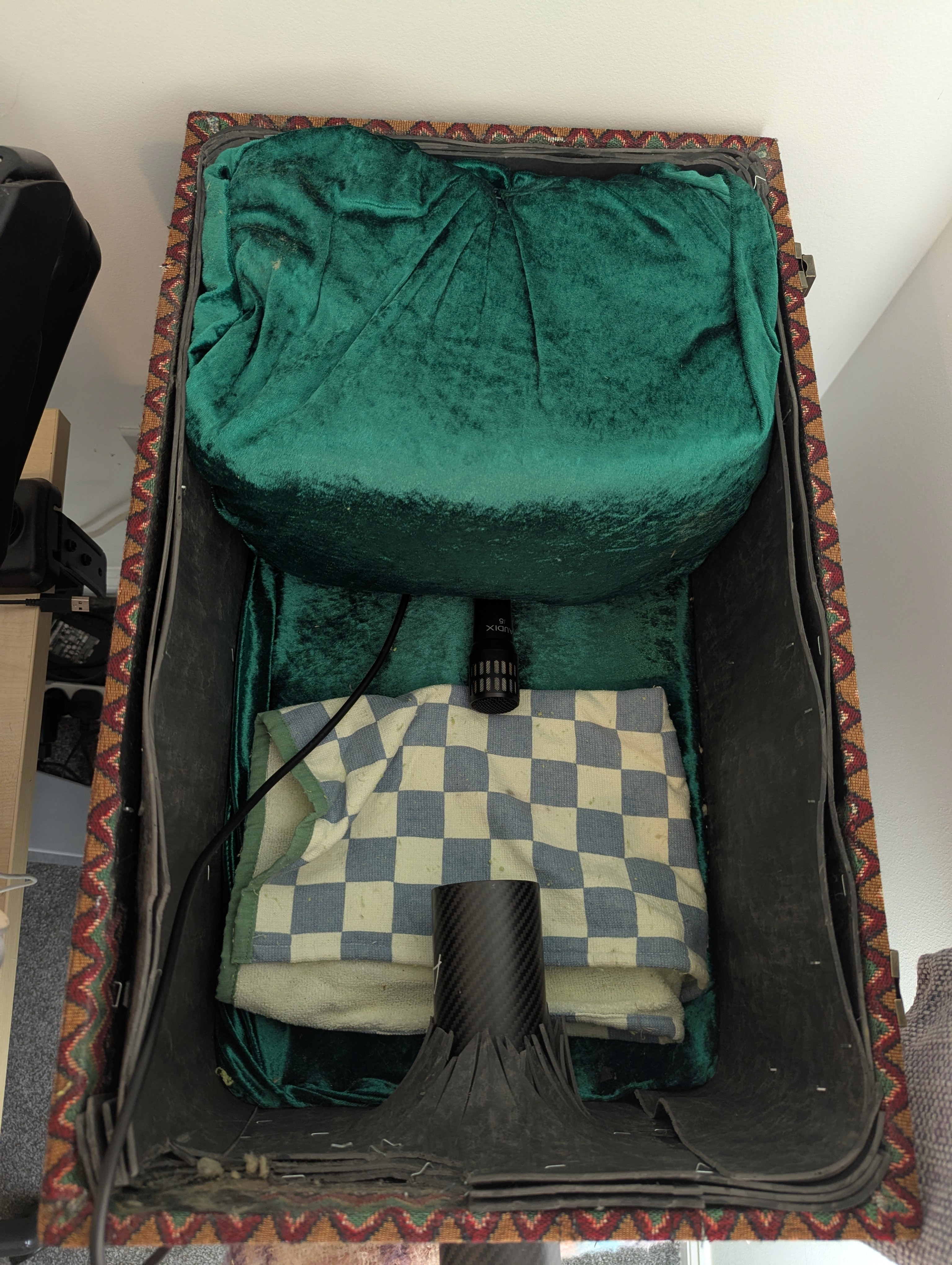 Inside the finished didgeridoo sound-reduction box showing the Airdidge bell, internal microphone and fabric-covered acoustic treatment.