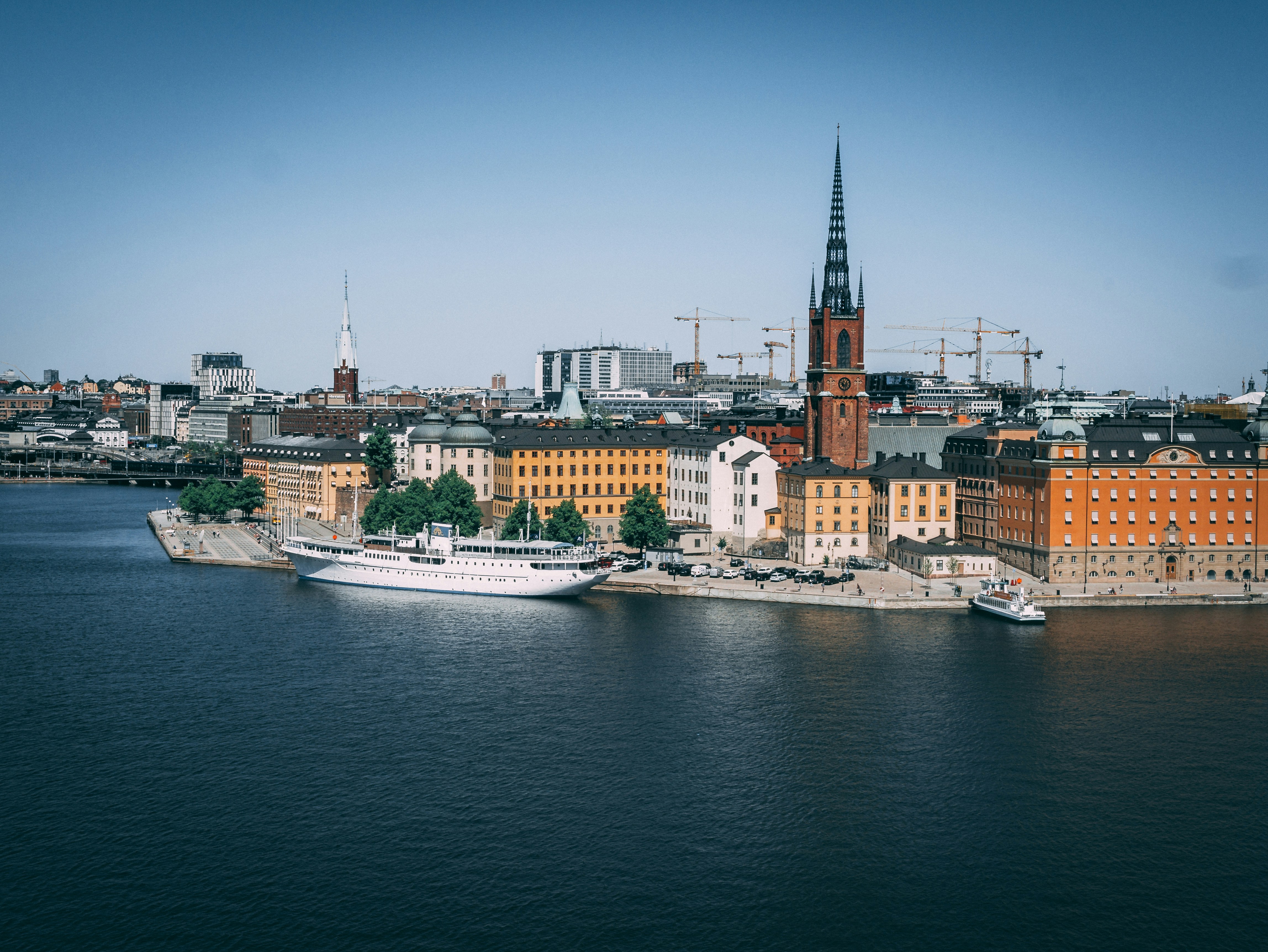 a large body of water with a city in the background