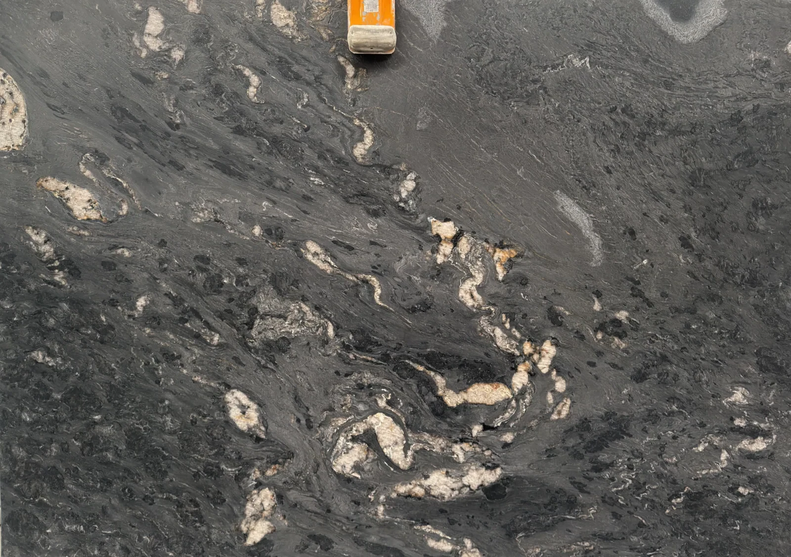 Titanium Gold leathered granite slab, right half of a bookmatched pair, mirrored