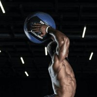 A man throwing a crossfit ball