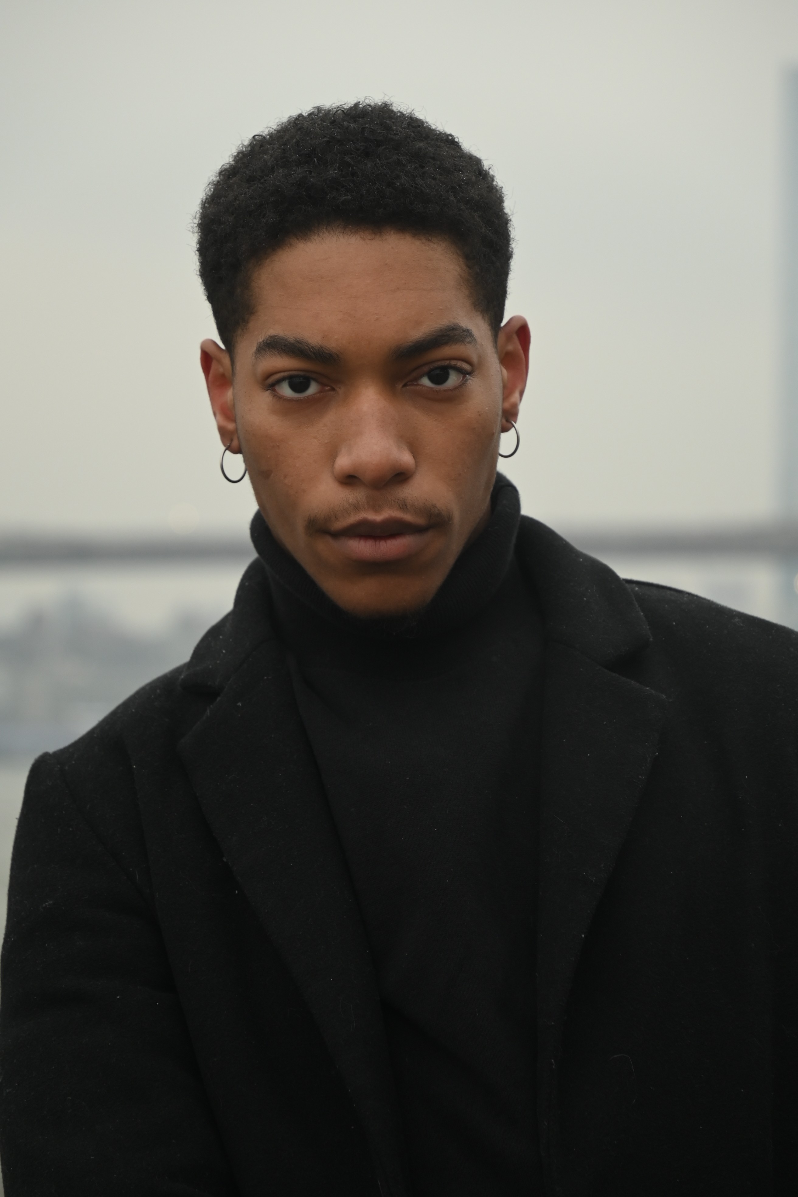 Stylish individual with all black outfit