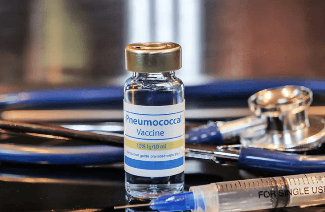 lady in white dress shirt holding white box