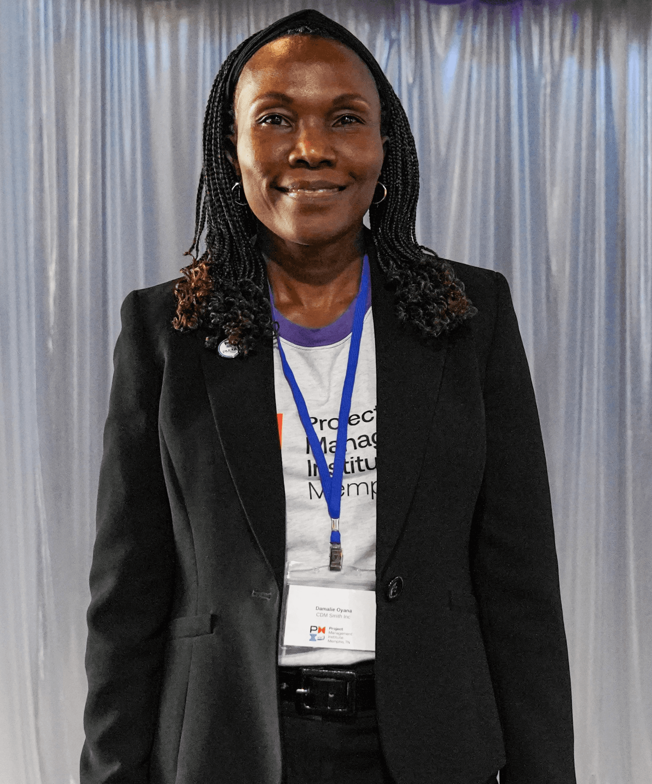 Profile portrait of a man in a white shirt against a light background