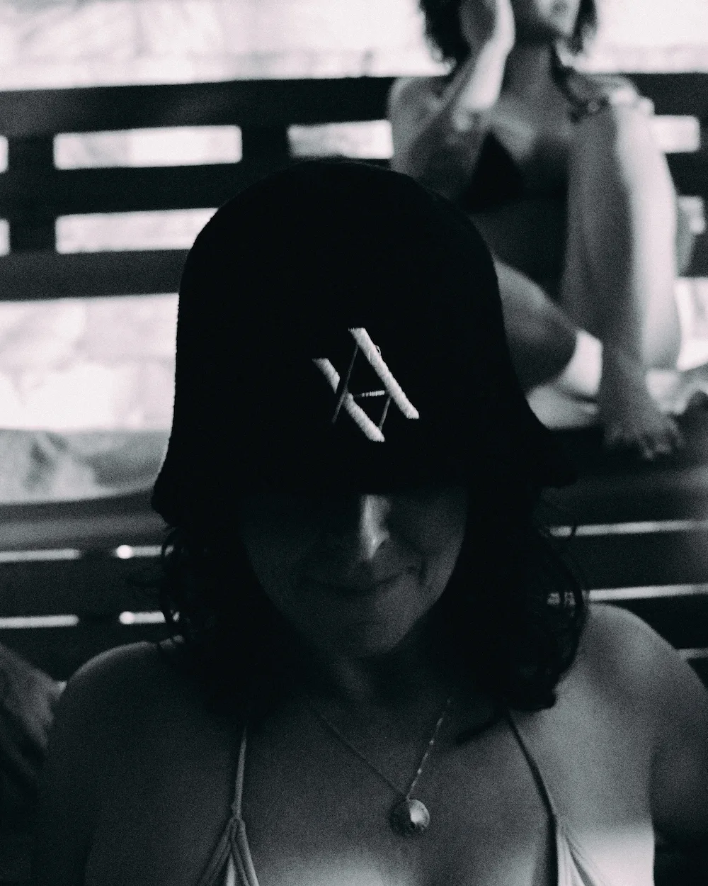 Guest wearing a wool sauna hat during a meditative heat ritual in AetherHaus, Vancouver.