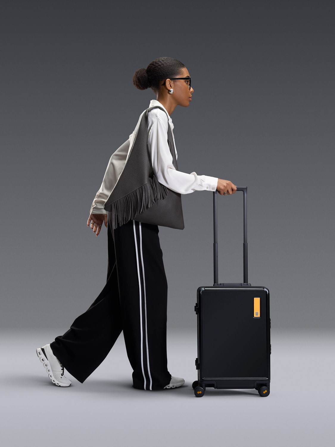 A model packing the Level8 Hegent suitcase photographed by Matthew Brown (London product photographer).