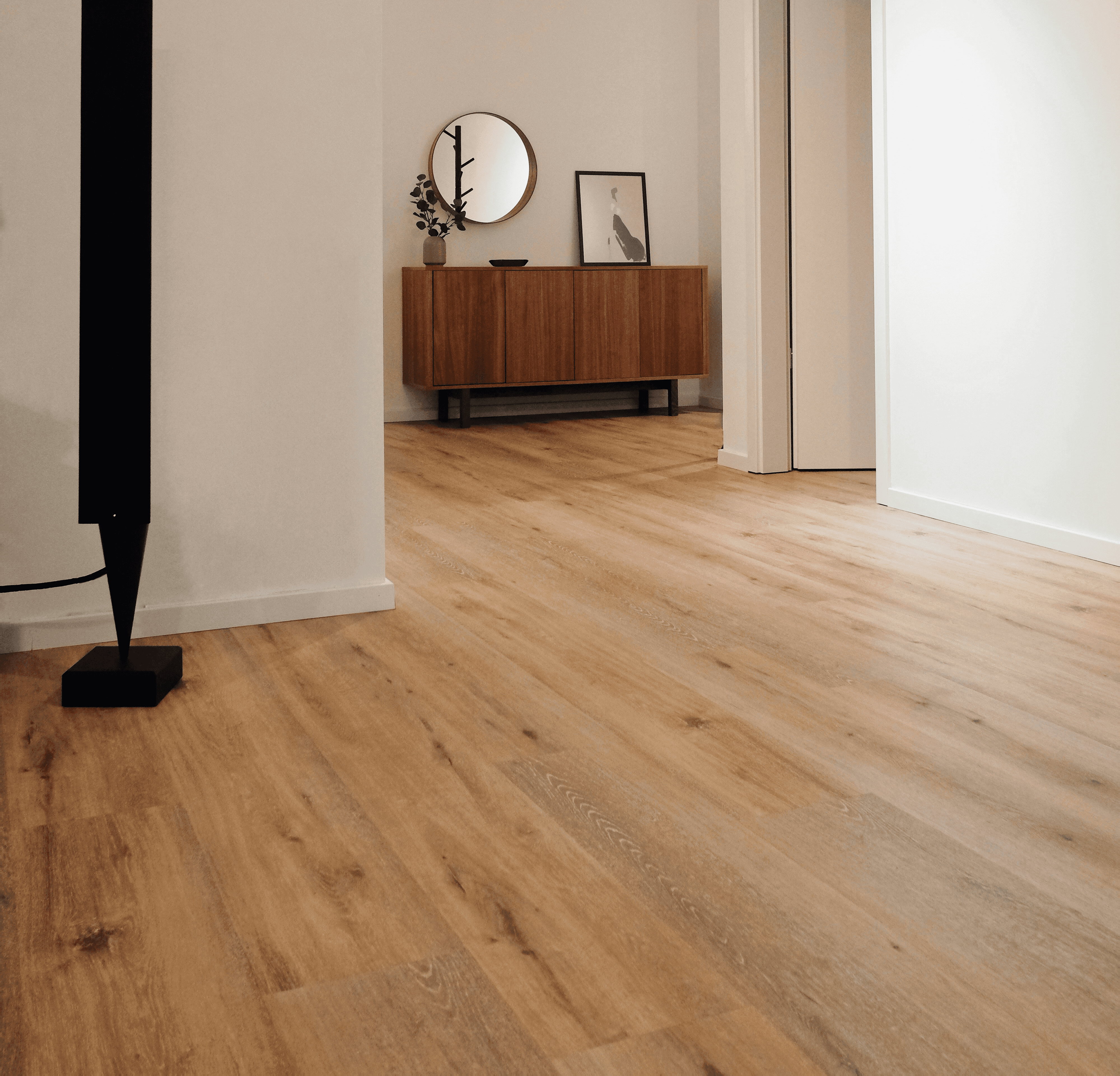 black tower speaker beside white wall