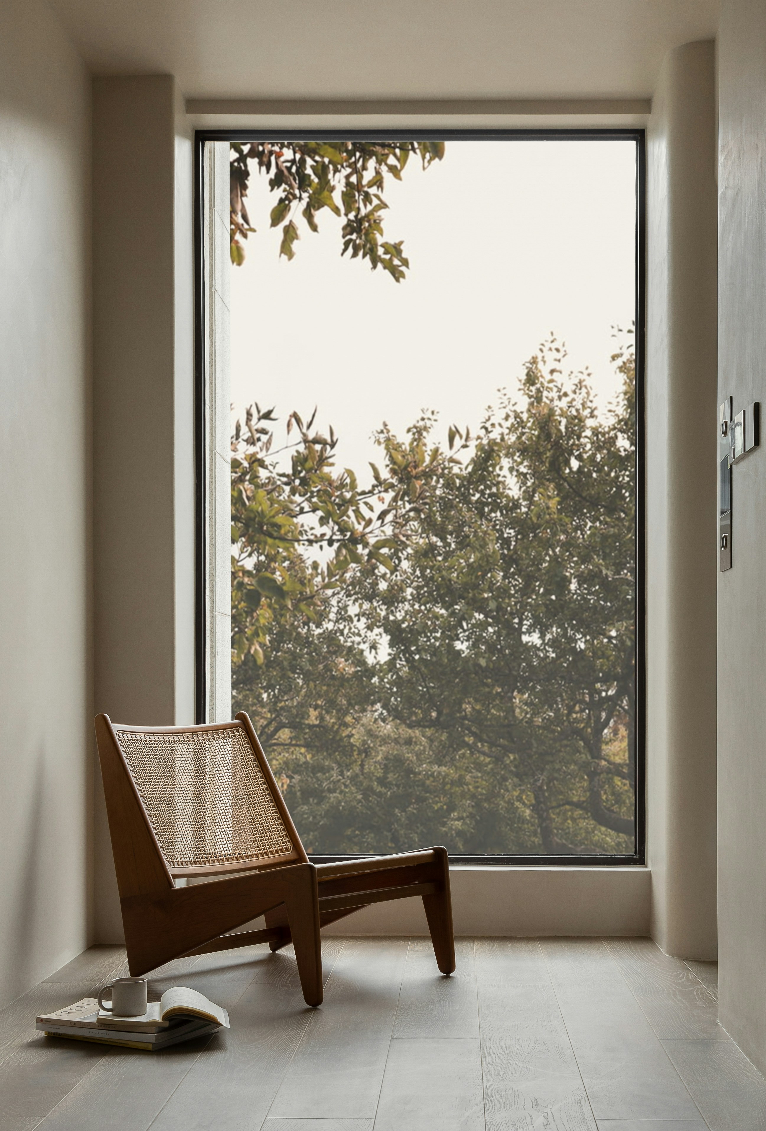 a chair sitting in front of a large window