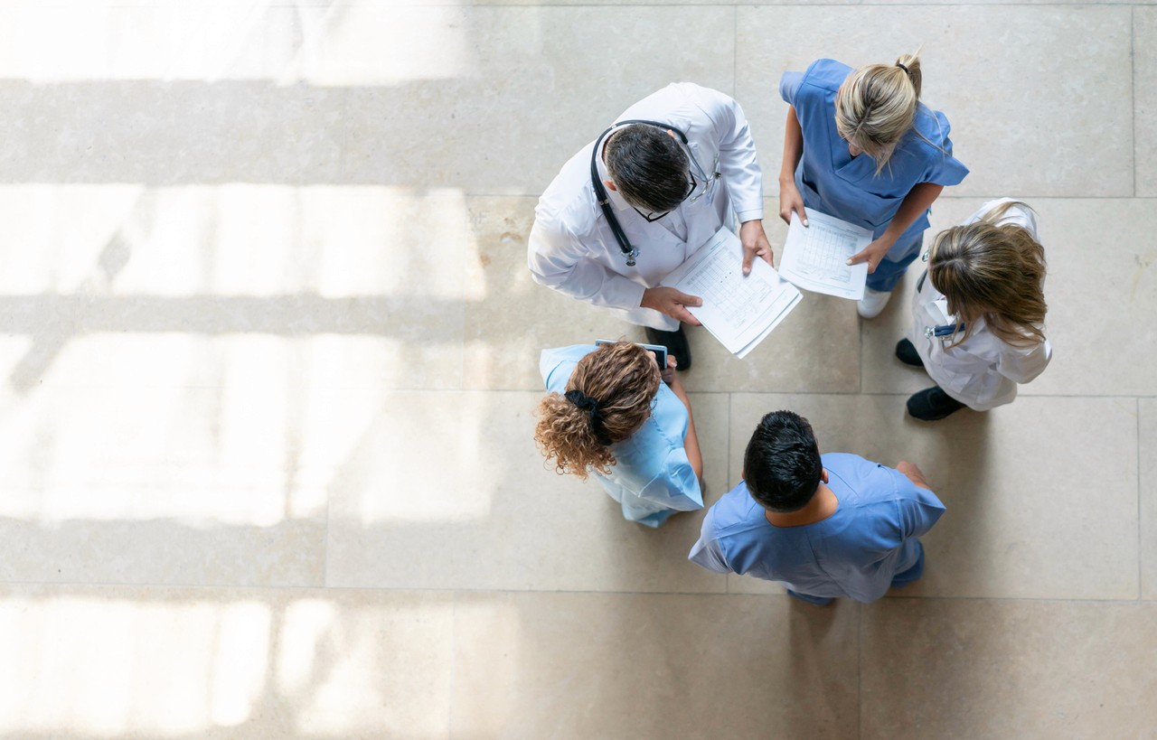 several doctors talking in circles