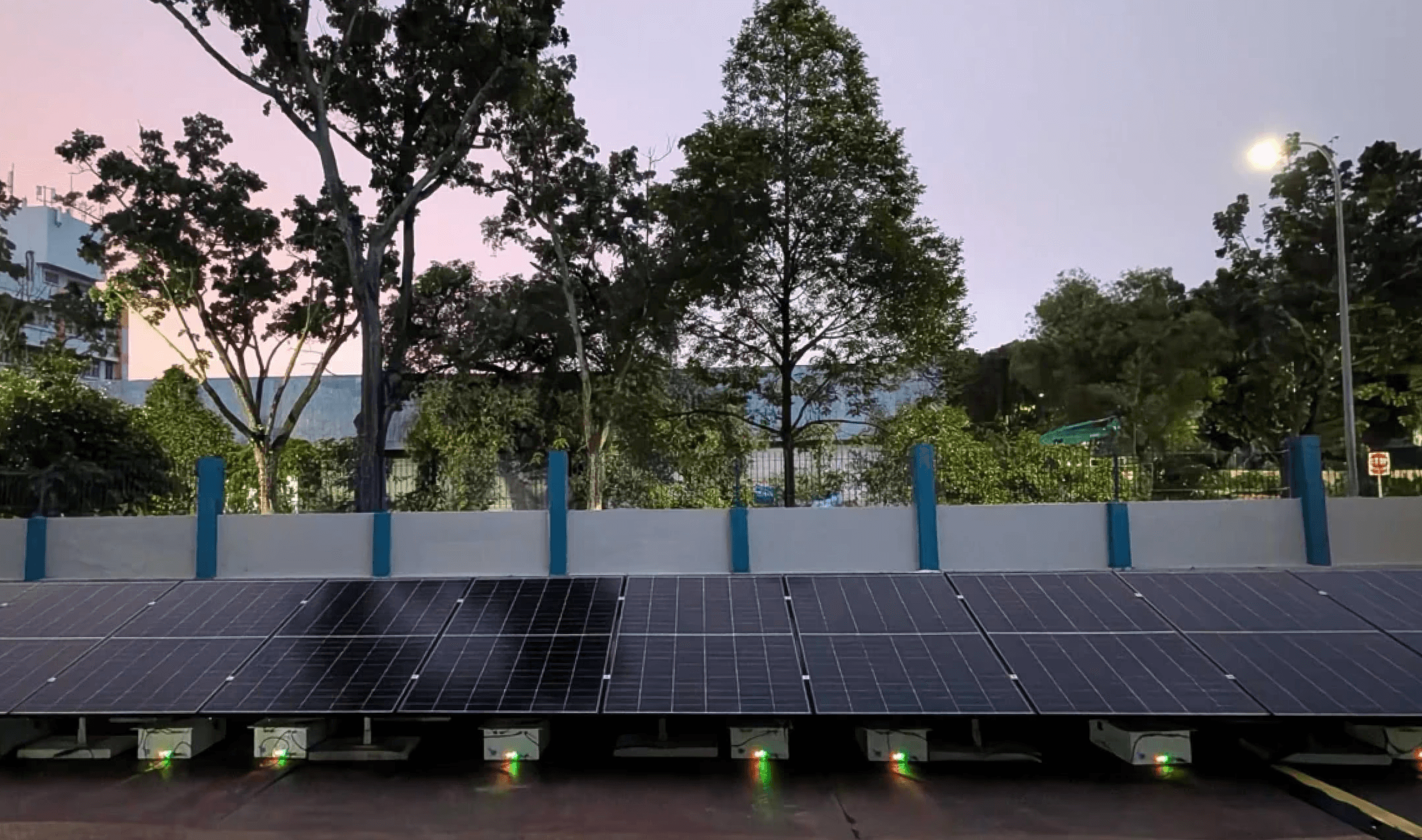 Rooftop battery storage paired with solar panels at a business campus.