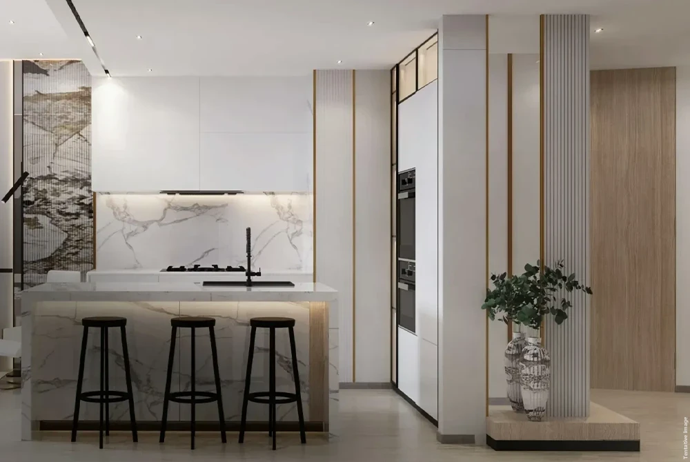 Stylish kitchen with wooden floors and a large island, reflecting a modern design and inviting atmosphere.