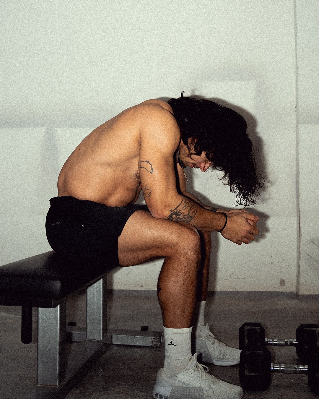 A woman with a head made of mirrors, reflecting light and creating a kaleidoscopic effect around her.