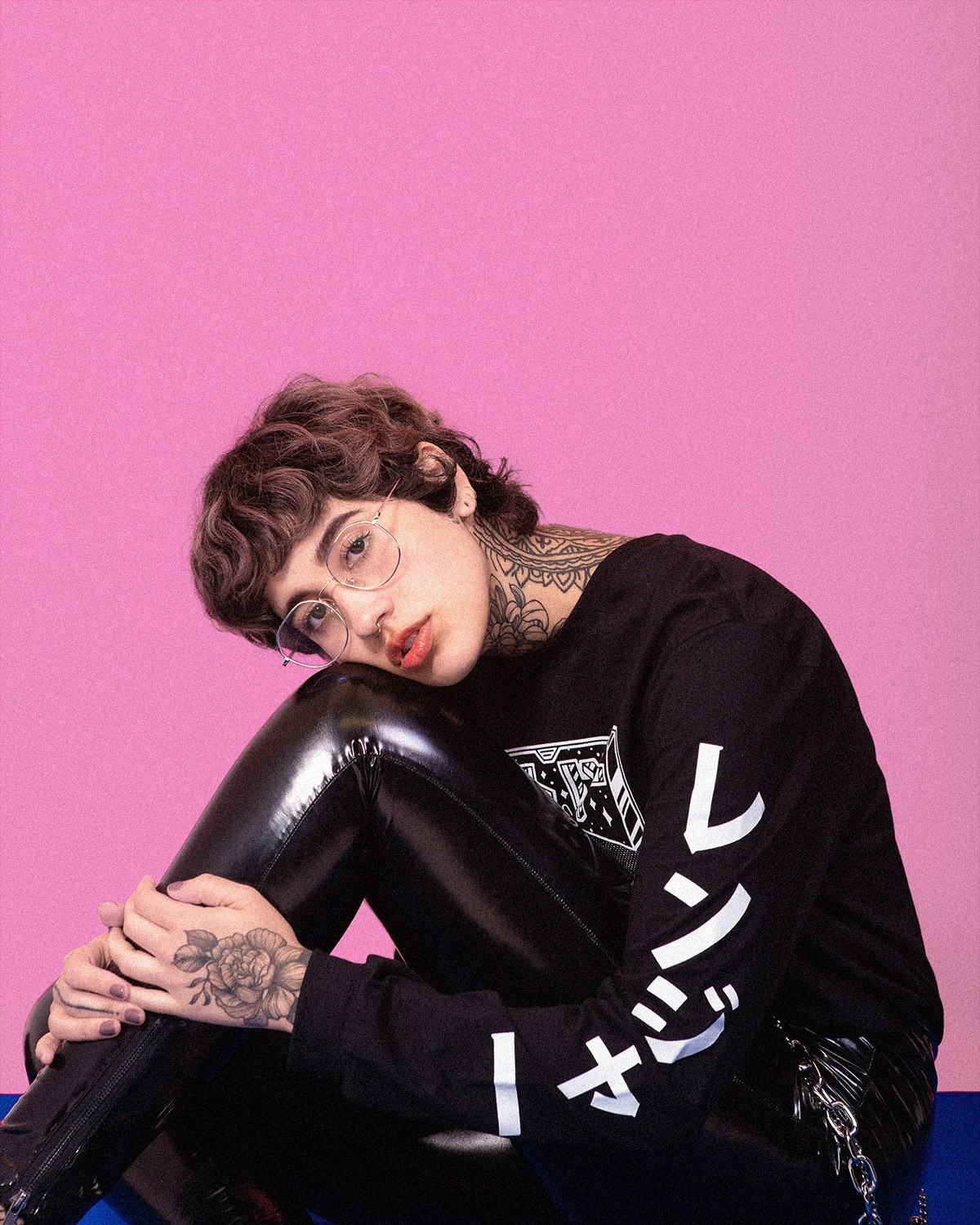 Narrow street lined with shops and greenery