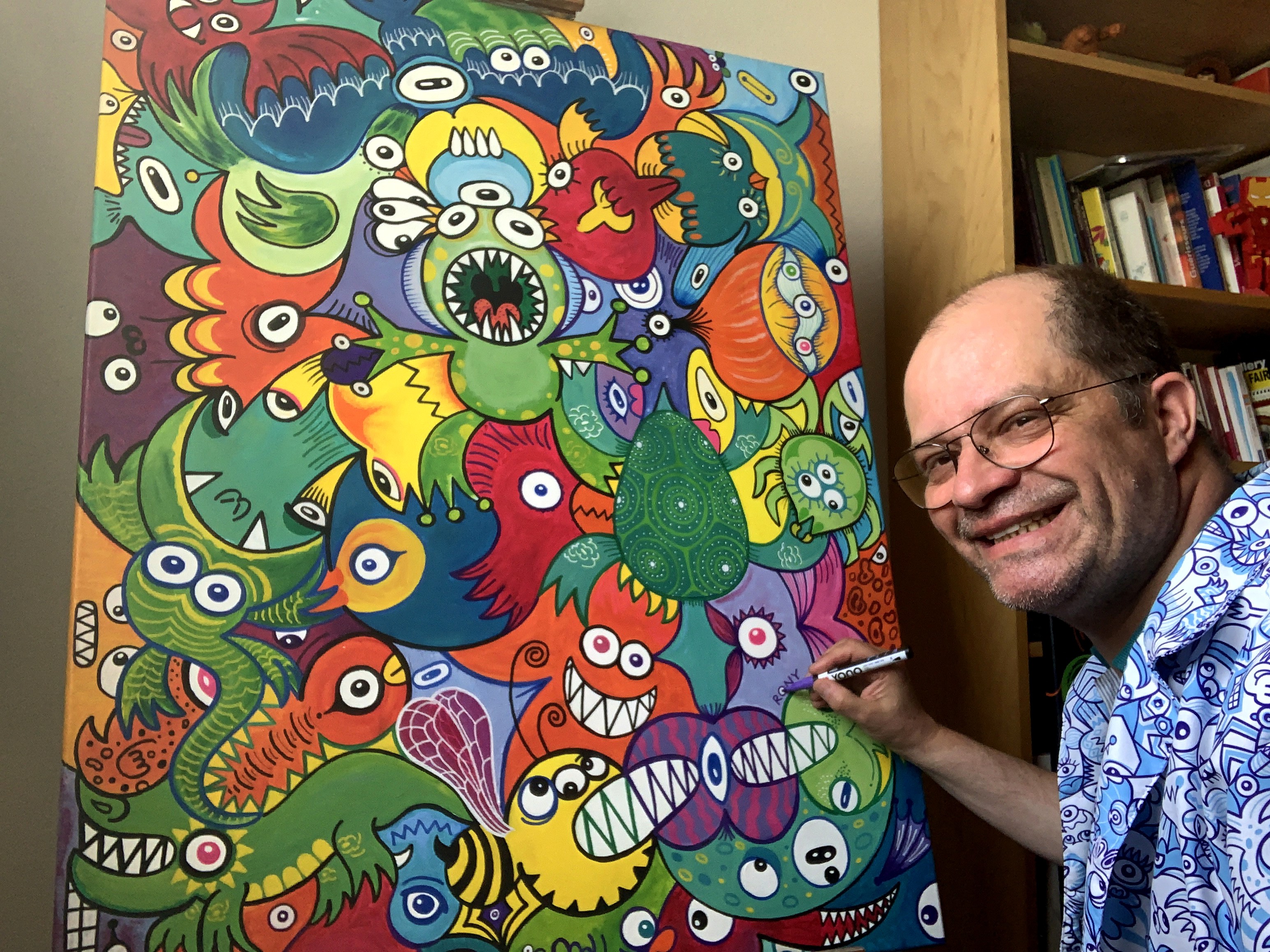 RONY signing his painting "Doodleliciously"