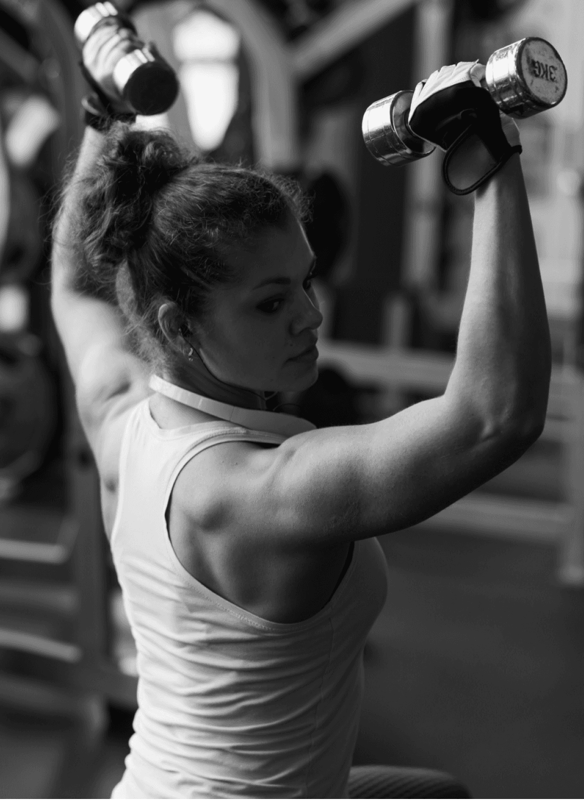 woman using two dumbells