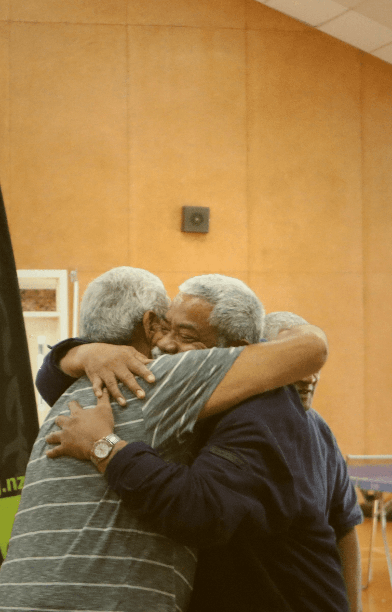 Two men sharing a hug