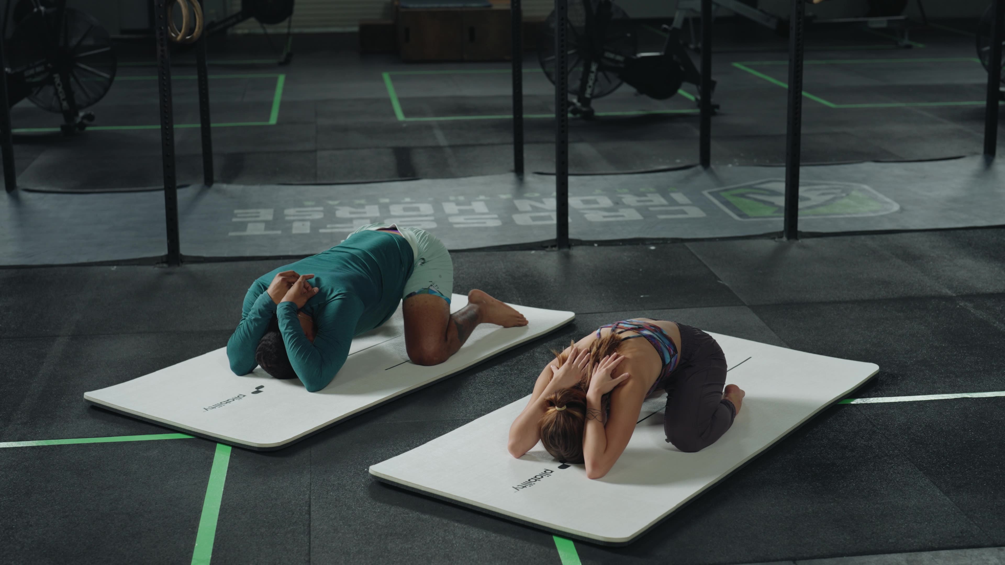 two people stretching - Lower Back Stiffness