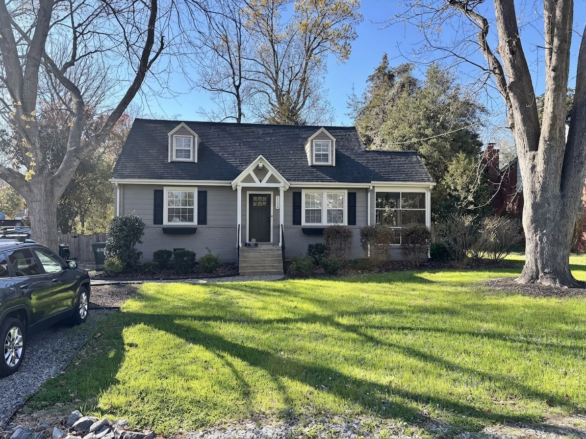 Cape Cod brick house with matte black front door