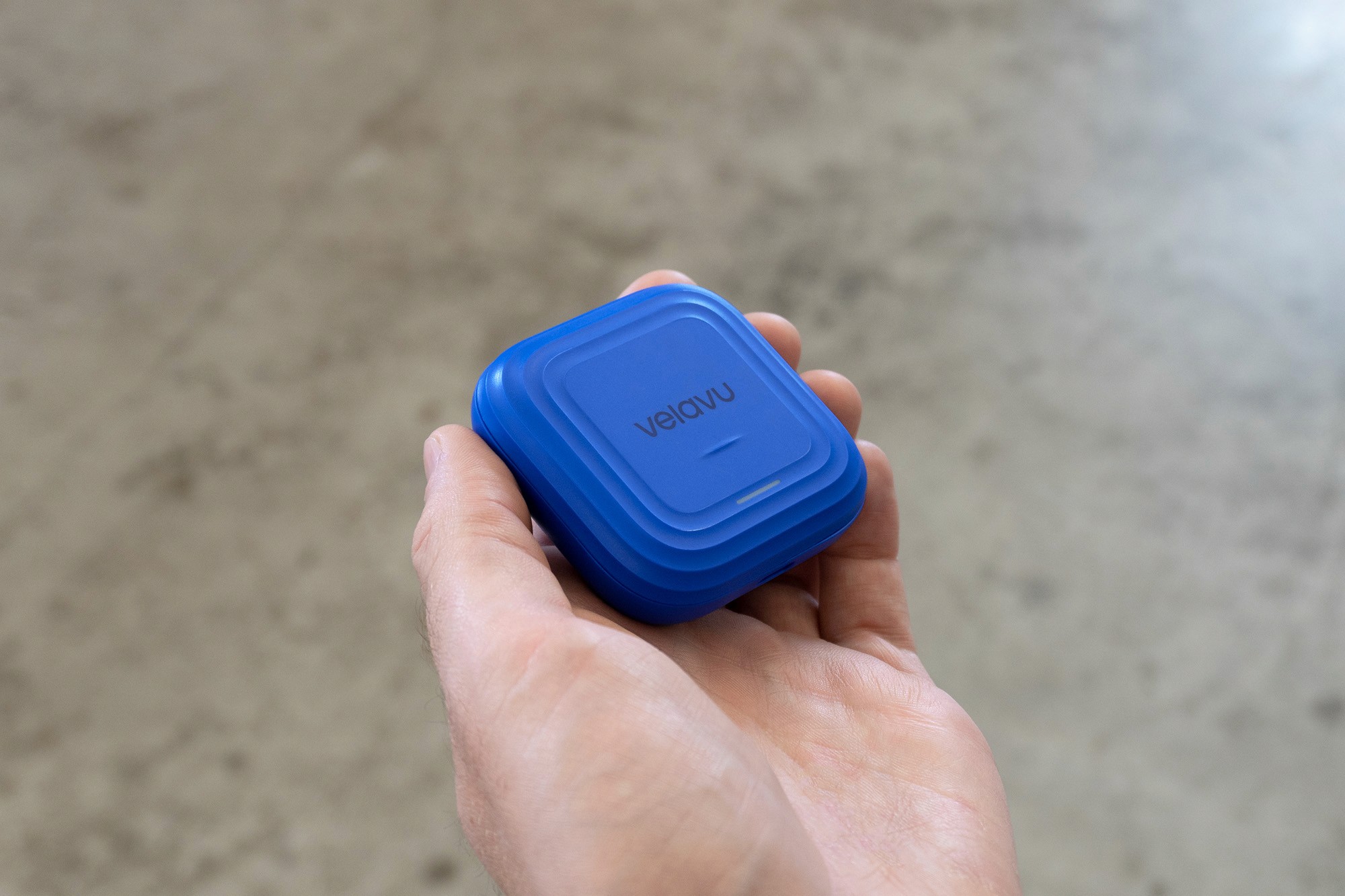 Person holding Velau Vesta device