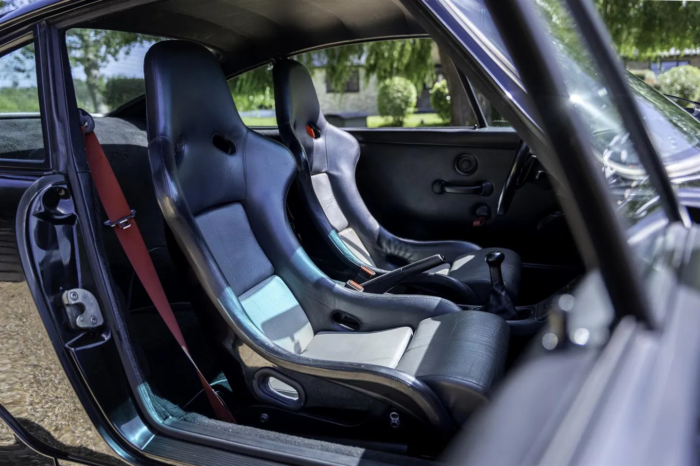 Pair of RS bucket seats with red harness belts