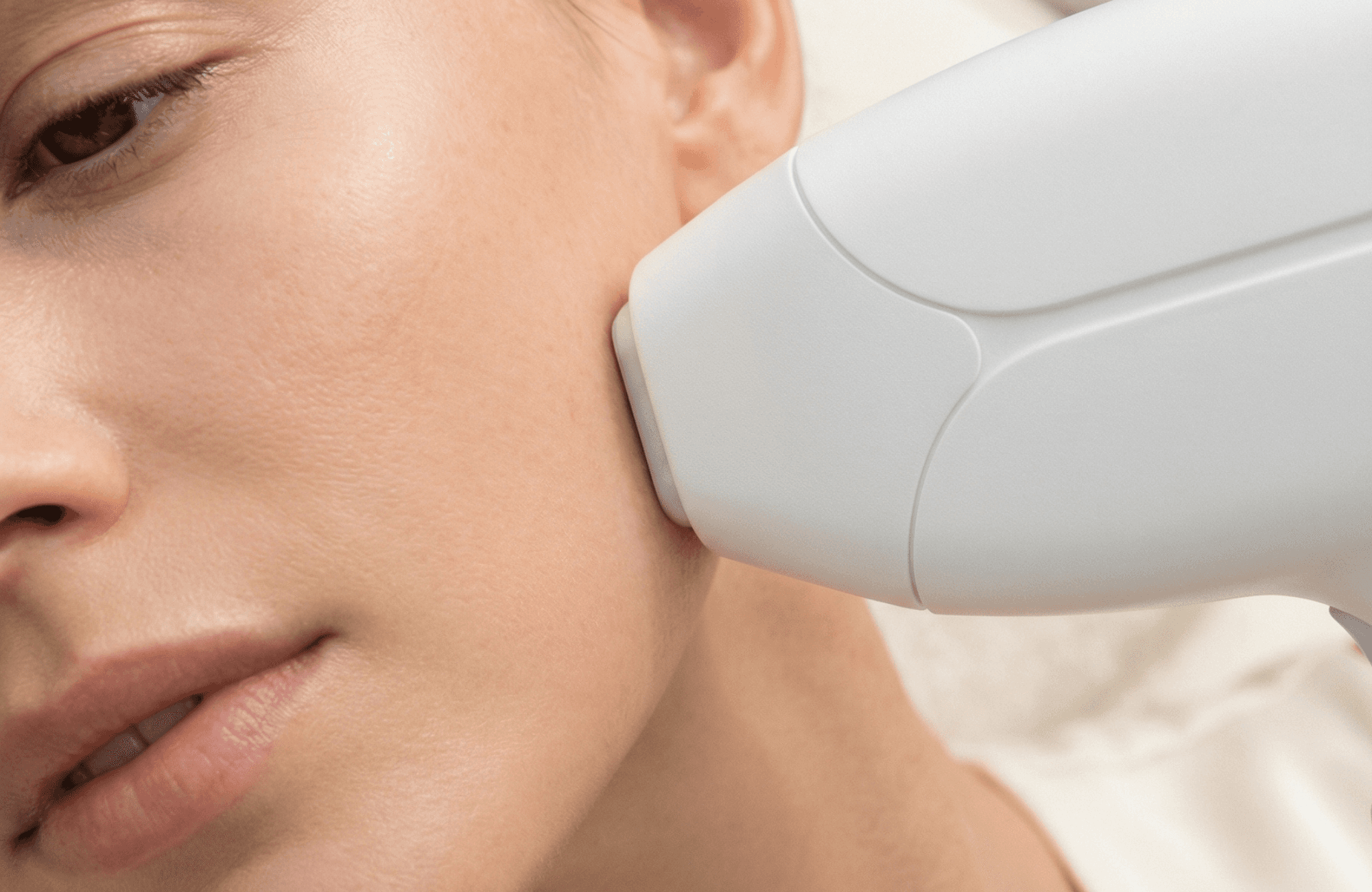 Woman receiving customized facial treatment targeting acne, dark circles, and double chin reduction for clear, balanced skin.