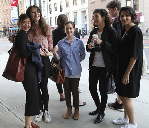 group photograph of people on the sidewalk