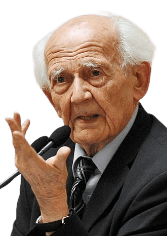 Color portrait of an elderly man with thinning white hair and expressive features, speaking into a microphone with one hand gesturing thoughtfully. Dressed in a suit and striped tie, he appears engaged and articulate, conveying a sense of wisdom and intellectual presence. The background is softly blurred, focusing attention on his expression and gesture.