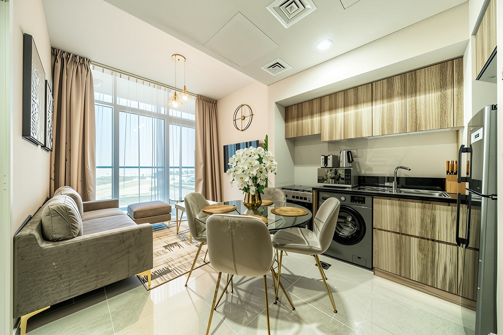 Interior view of a contemporary apartment showcasing a spacious living room and dining area, ideal for relaxation and dining.