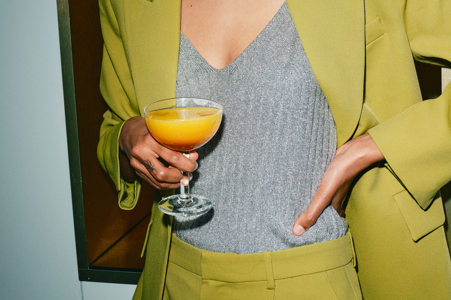 Close up of woman holding a cocktail