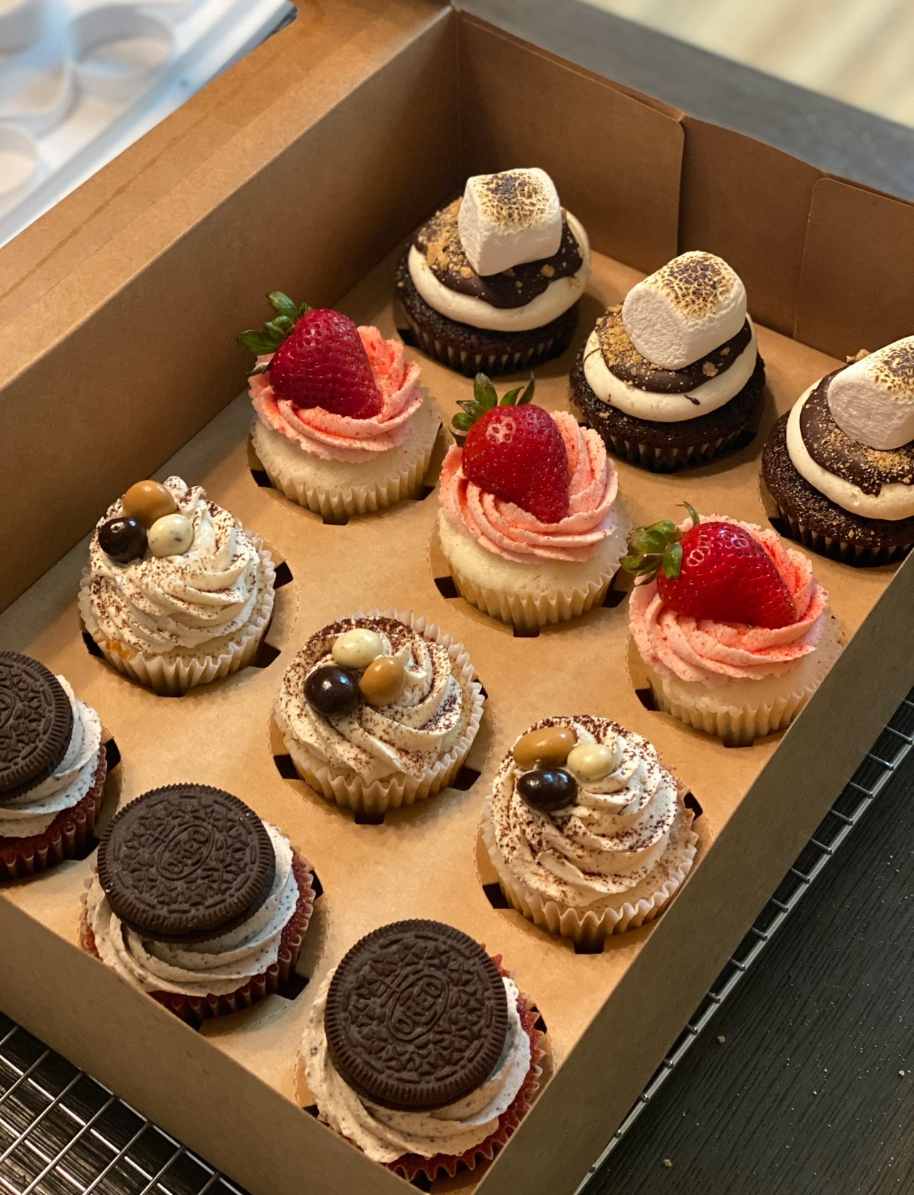 Milk being poured into black coffee in white cup