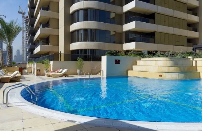 Wide view of Grosvenor Commercial Tower and surrounding urban landscape in a key business district.