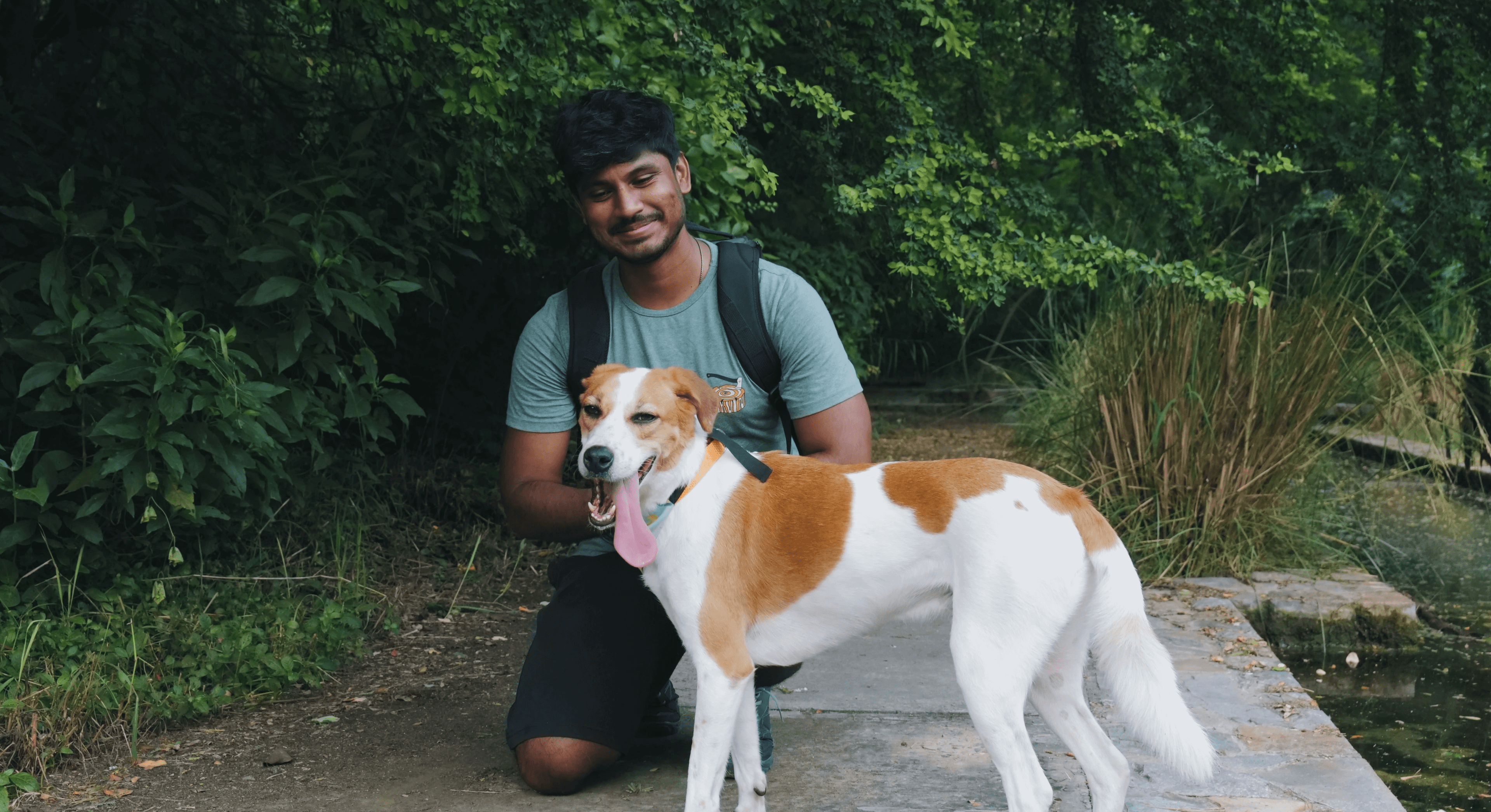 Nishant and Blaze, an Indian Pariah Dog, in a dense forested area of Sunder Nursery, an ecological park.