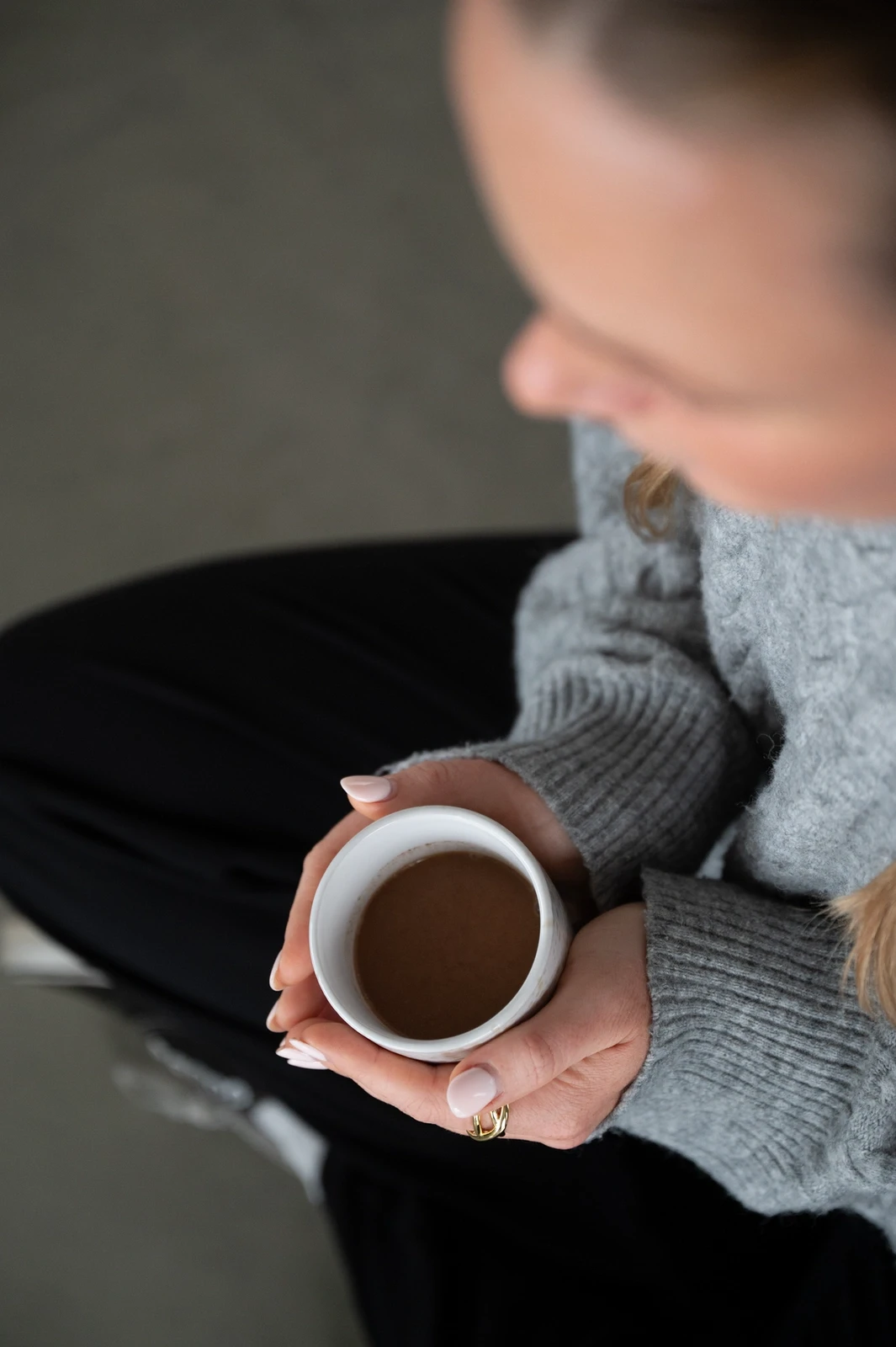 Close up of a woman with eyes closed practicing deep breathing