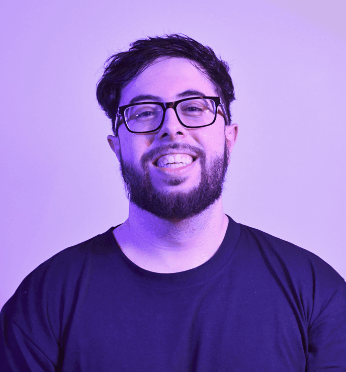 A woman with straight blonde hair wearing a light colored sweater looks away.