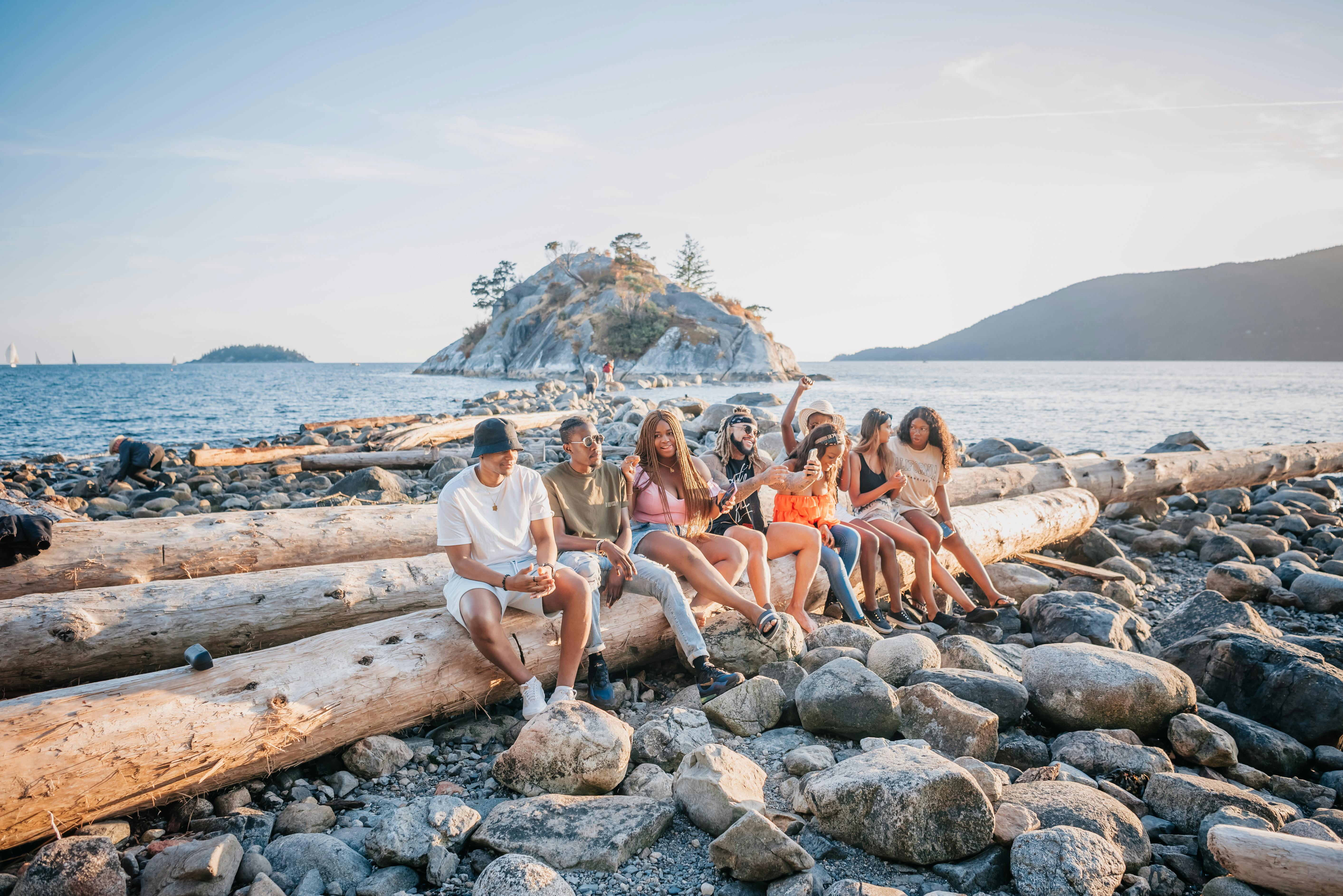 Group of newcomers making friends at a local community beach meetup in Vancouver