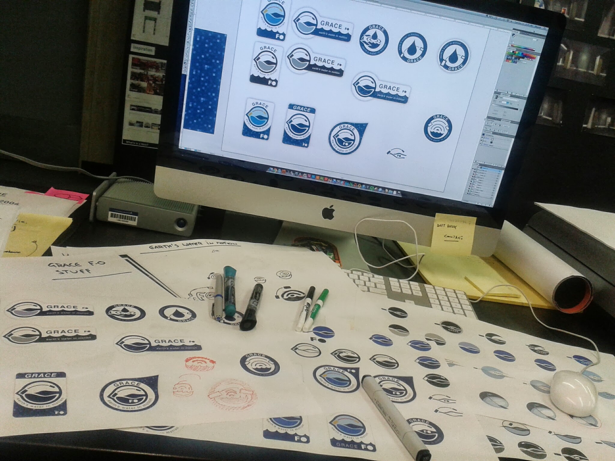 logo design proposals on computer screen