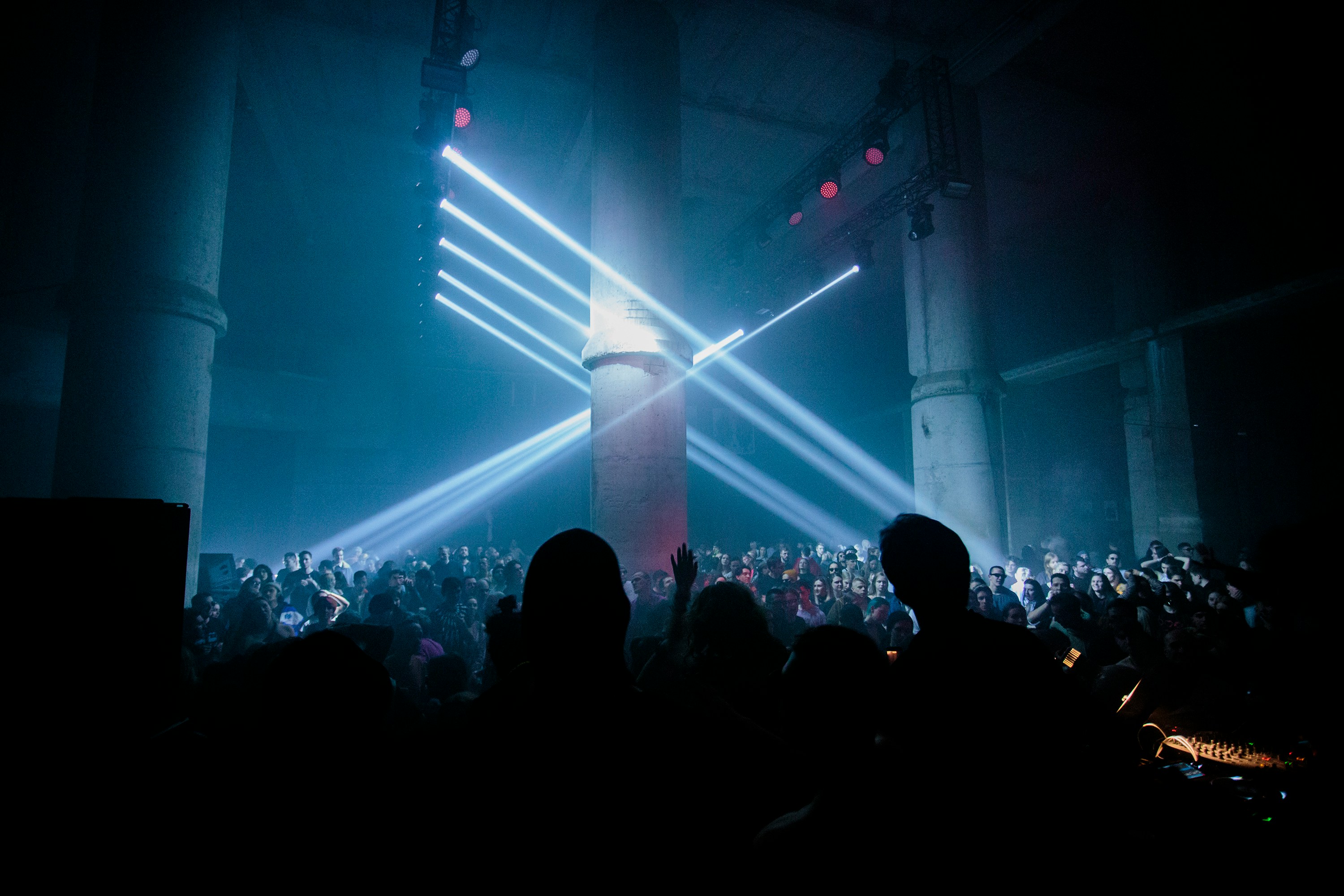 a group of people standing in front of a stage