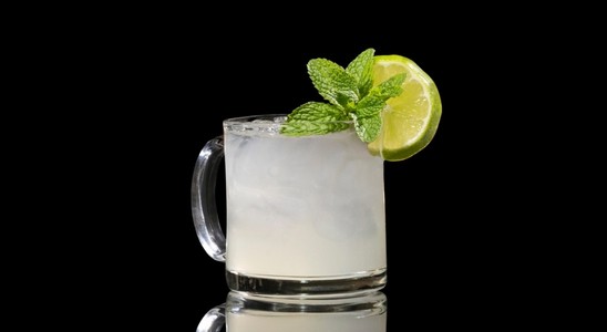 A closeup of a Austrian Mule drink against a dark background.