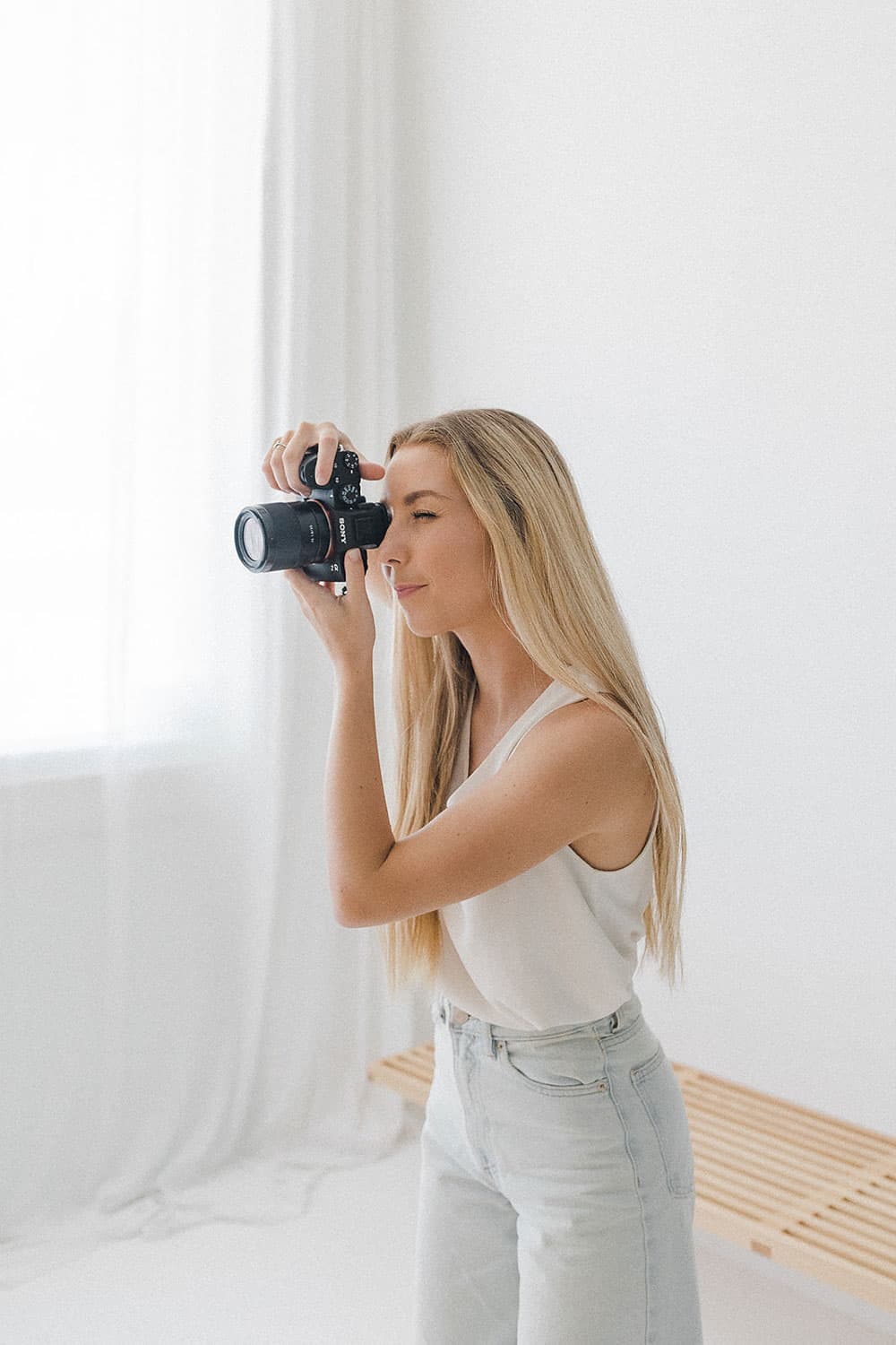 Woman taking a photograph with her camera