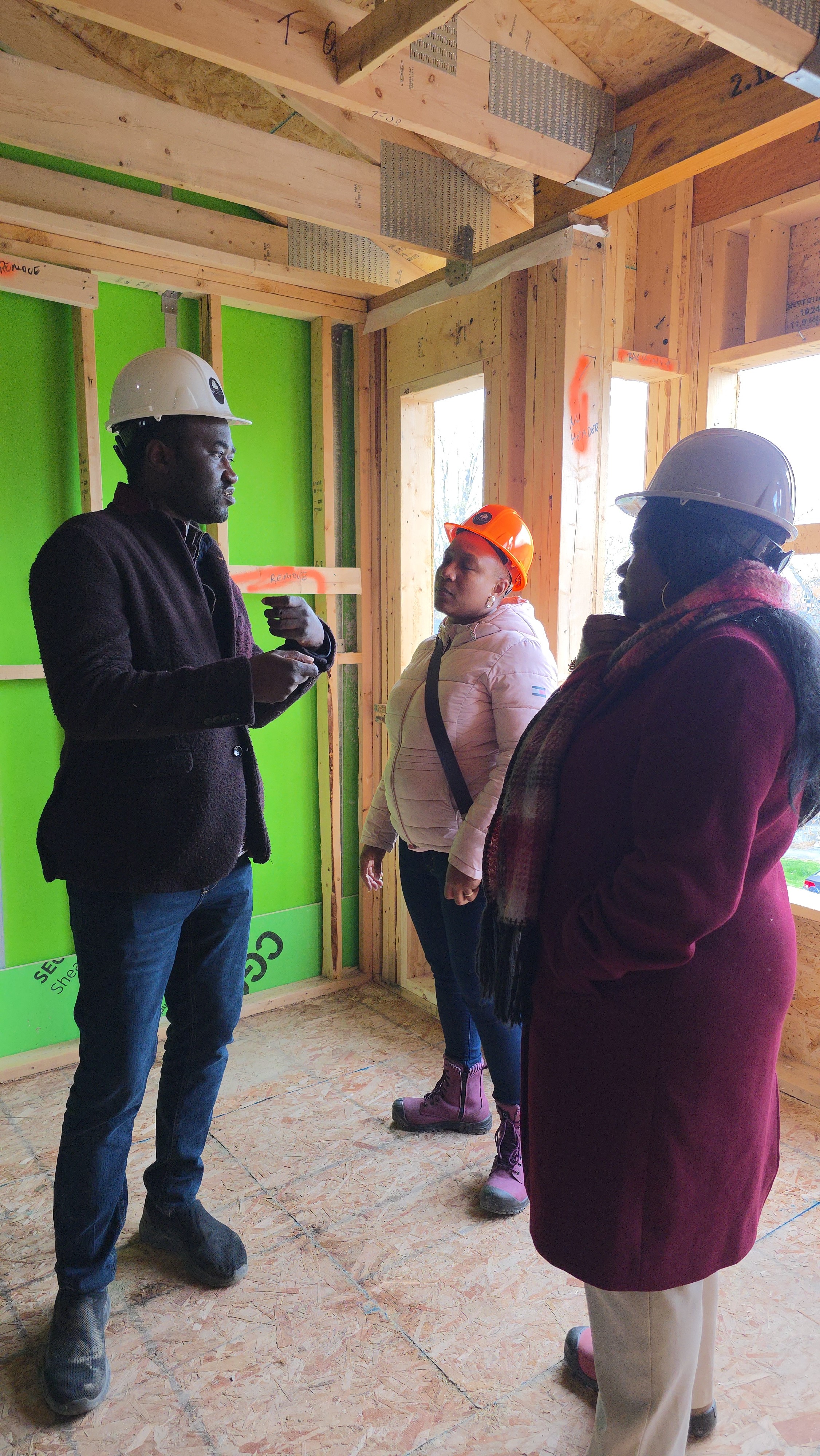 Team reviewing a building under construction