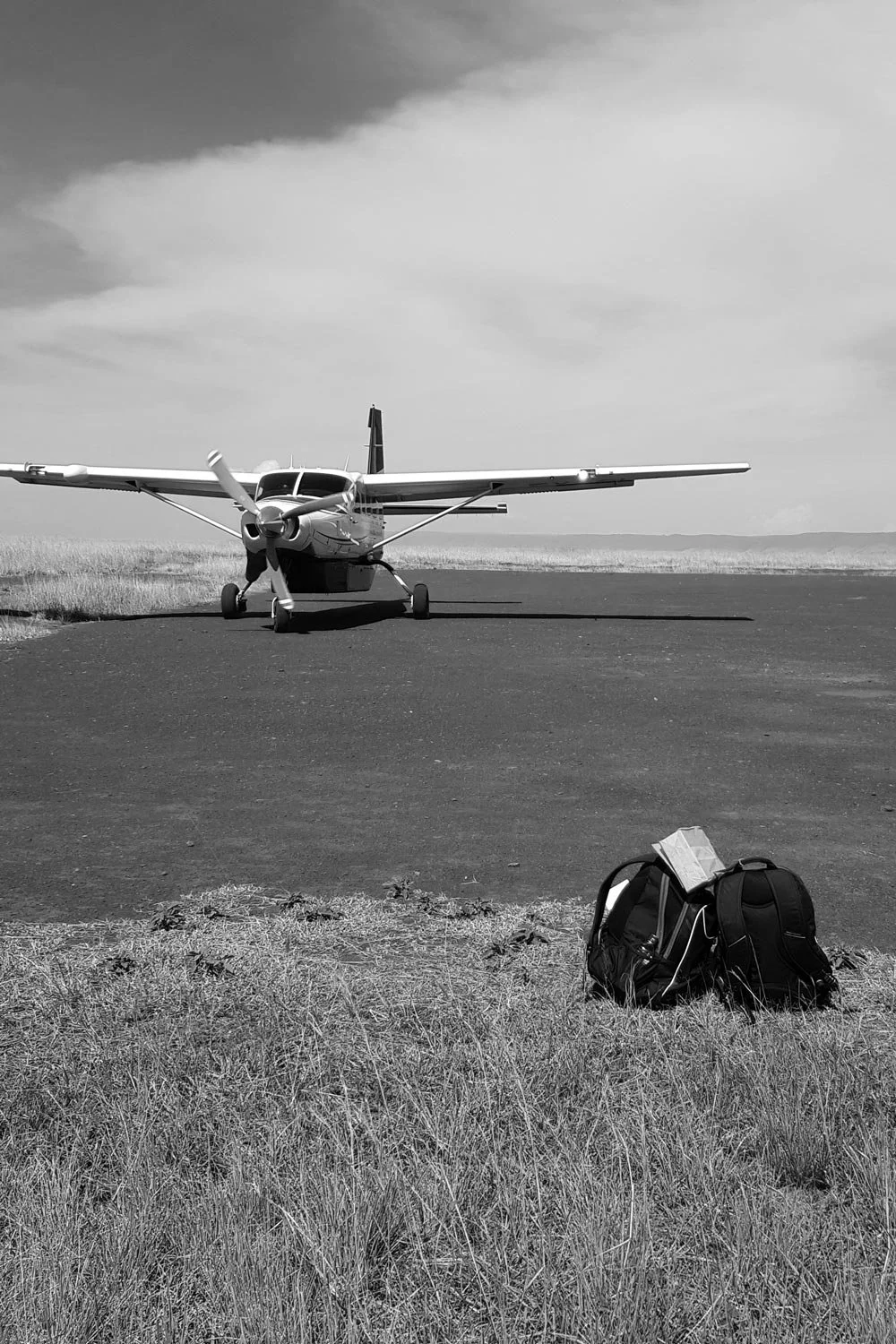 Luxury private jet interior with rows of comfortable leather seats and mood lighting