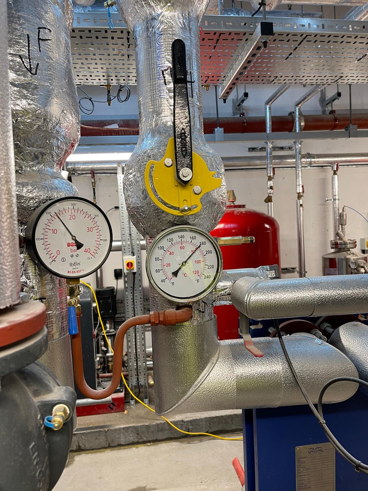 Heating system gauges and insulated commercial pipework