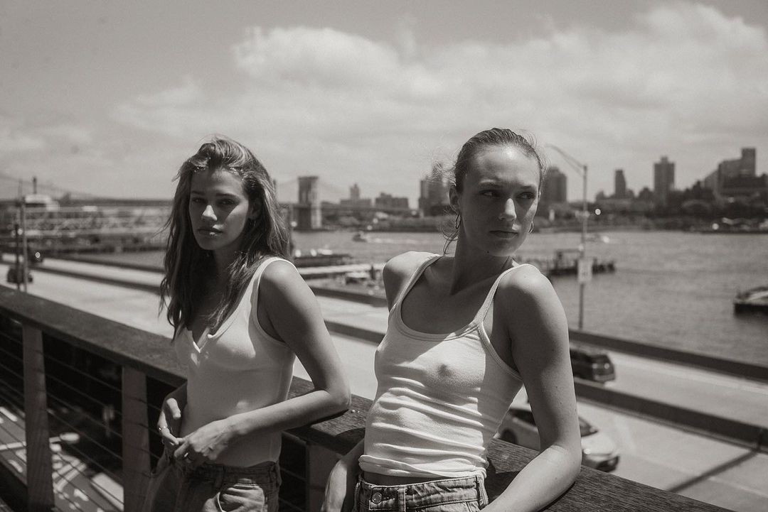 two girls on a bridge