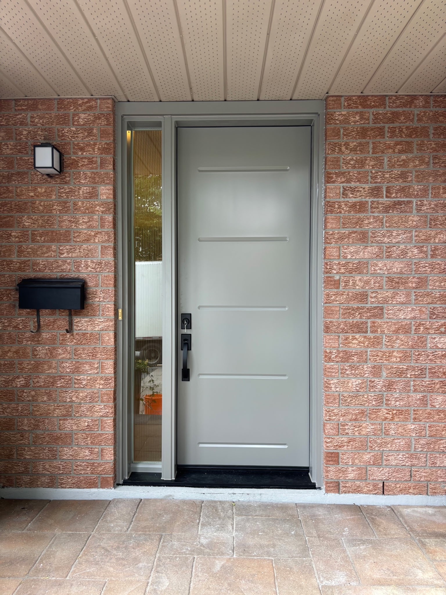 The Imperial — black frame window installation, Ottawa home exterior